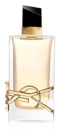 Saint Laurent Libre Eau de Parfum bottle with a clear glass body, pale amber liquid, a gold-tone YSL logo on the front, and a black cap, shown on a white background.